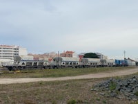 a train on a track near a city