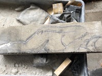 a drawing of a woman on a block of cement