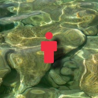 a red person is floating in the water