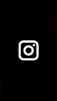 a black background with a white instagram logo