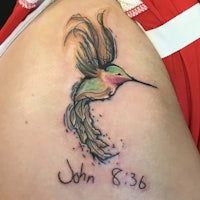 a tattoo with a hummingbird on it