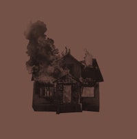 a house with smoke coming out of it
