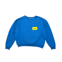 a blue sweatshirt with a yellow logo on it
