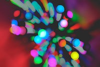 a blurry image of colorful lights on a dark background