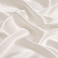 a close up image of a white silk fabric