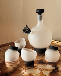a black and white tea set on a table