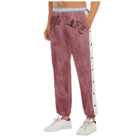 a woman wearing a maroon sweatpants with the word love on them