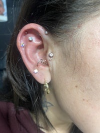 a woman with ear piercings on her ear