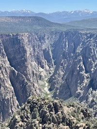 a view of a canyon from the top of a mountain