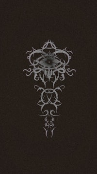 a black background with an image of an ornate design