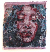 a piece of fabric with a woman's face on it