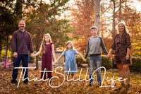 a family is standing in the fall with the words that still live