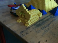 a wooden table with legos on it