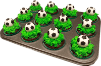 soccer cupcakes in a pan with green grass