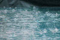 water droplets in a pool with a tarp