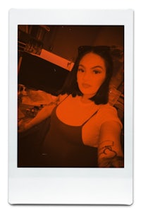 polaroid photo of a woman with tattoos