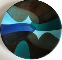 a plate with a blue and brown design on it