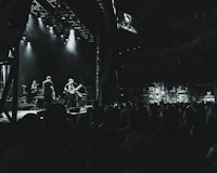 a black and white photo of a crowd at a concert