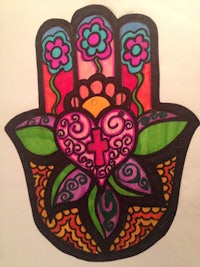 a drawing of a hamsa with flowers on it