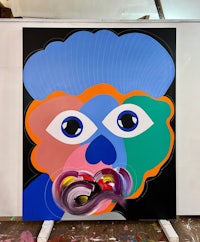 a painting with a colorful face on it