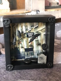 a black frame with a skull in it