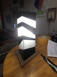 a black and white lamp on top of a table