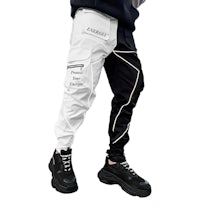 a man wearing black and white jogger pants