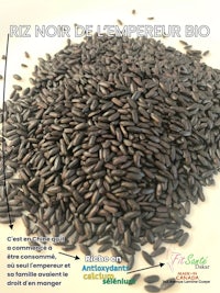 a pile of black seeds with a label on them