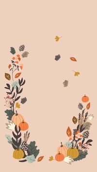 autumn leaves and pumpkins on a beige background