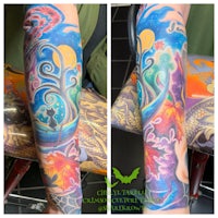 a colorful tattoo on the arm of a person