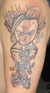 a dragon ball tattoo on a man's arm