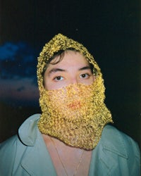 a man wearing a yellow knitted hat