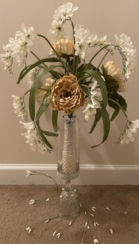 a bouquet of flowers in a glass vase