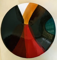 a glass plate with a colorful design on it