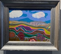 a framed painting of a colorful landscape on a wall