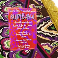 a colorful invitation with a paisley pattern on it