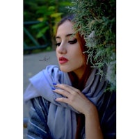 a beautiful woman wearing a scarf and lipstick