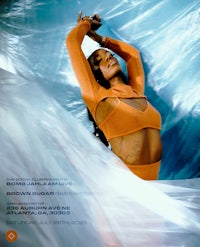 the cover of a magazine with a woman in an orange outfit