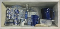 a painting of blue and white utensils and utensils