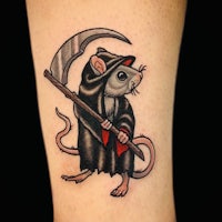a tattoo of a rat holding a scythe