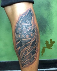 a man with a tattoo on his leg