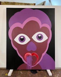 a painting with a purple face on it