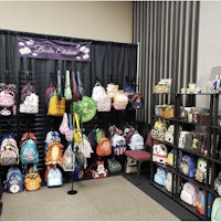 a display of backpacks on display at a convention