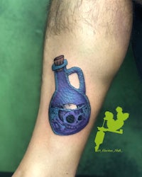 a tattoo of a purple bottle with a skull on it