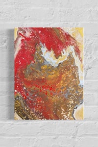 a red and gold abstract painting on a brick wall