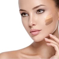 a woman is posing with a concealer on her face