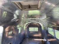 the inside of a silver airstream trailer