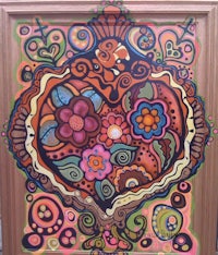 a colorful painting of a heart in a frame