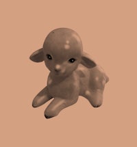 a small figurine of a lamb sitting on a beige background