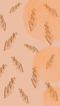 a pattern of leaves on a peach background